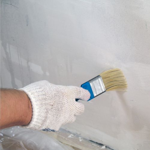 applying undercoat to walls